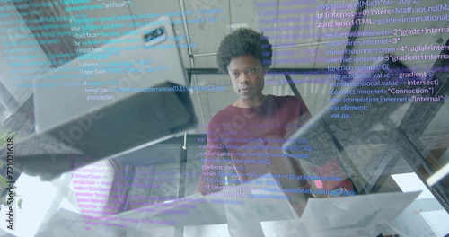 Image of data processing over african american businessman in office