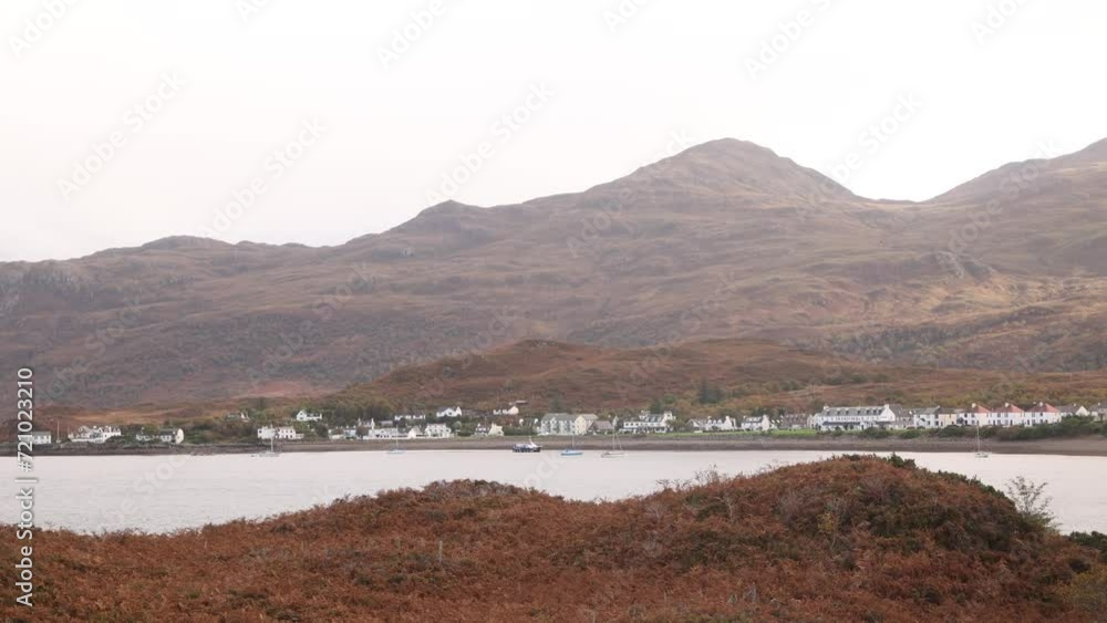 mountains and hills surrounding the water in the autumn at Isle of Skye, hIghlands of Scotland mountains and hills surrounding the water in the autumn at Isle of Skye, hIghlands of Scotland
