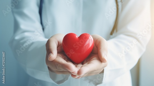 Doctors Hand Holding Red Heart Shape in Hospital - Love  Donor  World Heart Day  Health Insurance Concept AI Generated