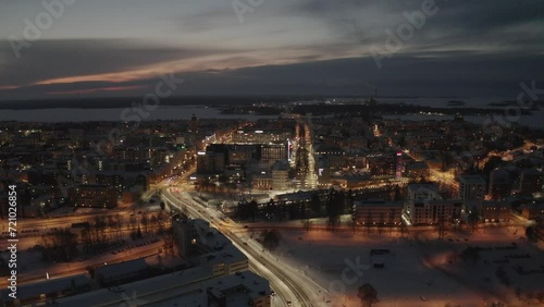 Aerial shot of the nighttime cityscape of downtown Vaasa city during winter, Finland photo