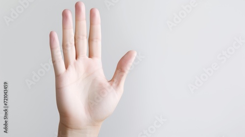 Close up of female hand showing ok sign isolated on grey background. Generative AI