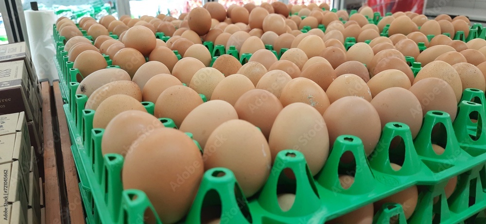 Eggs on a tray for sale in supermarket background