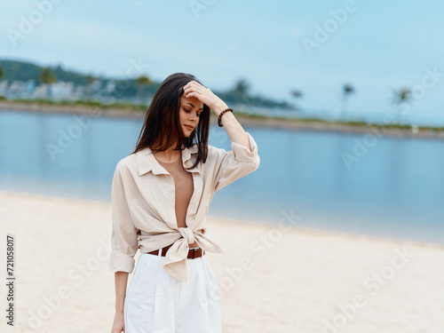 Sun-Kissed Summer  Radiant Woman at the Beach Embracing Nature and Leisurely Lifestyle