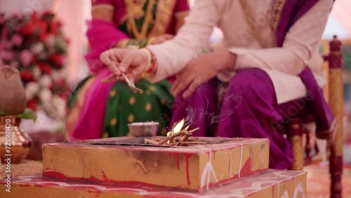 Indian groom and bride performing hindu wedding ritual for marriage ceremony   photo