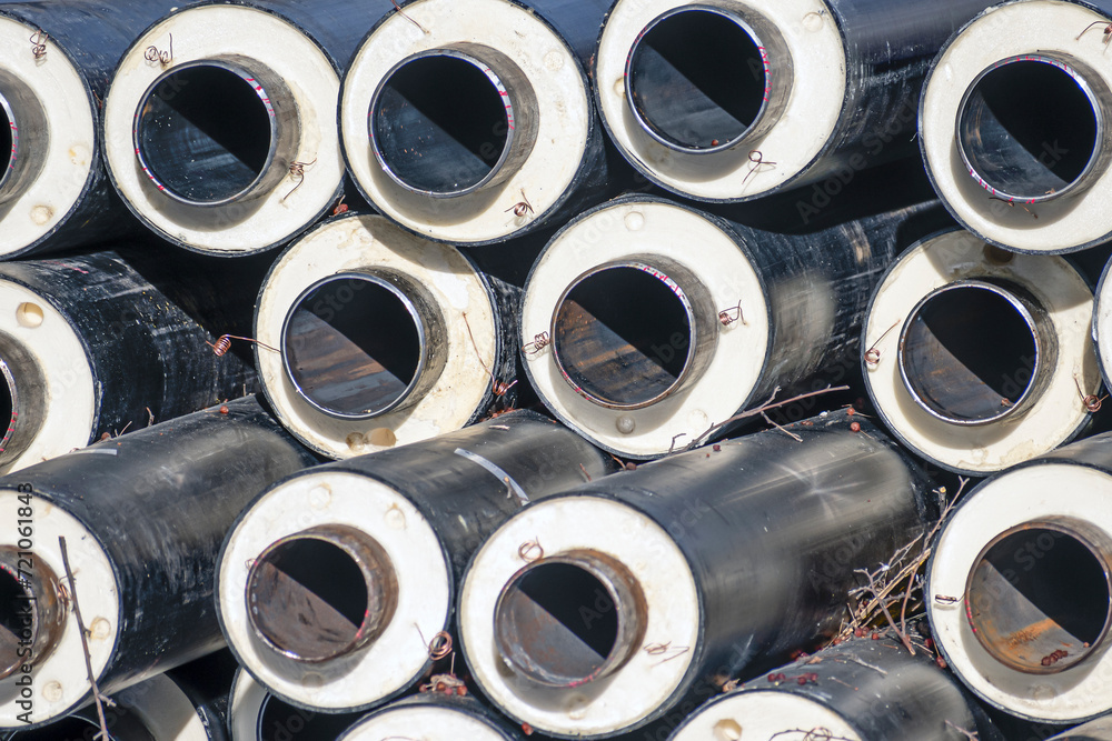 Pipes are stored at the construction site on a winter day Pipes are stored at the construction site on a winter day