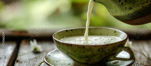 Refreshing Green Tea with a Splash of Creamy Milk: Unveiling the Sublime Blend of Green, Tea, and Milk in One Cup photo