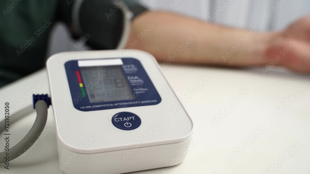 the girl measures blood pressure with a tonometer the girl measures blood pressure with a tonometer
