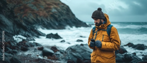 Wallpaper Mural man holding smart phone in the winter Torontodigital.ca