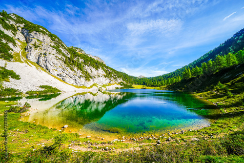 Schwarzensee on the high plateau of the Tauplitzalm. View of the lake at the Totes Gebirge in Styria. Idyllic landscape with mountains and a lake on the Tauplitz in Austria.
 photo