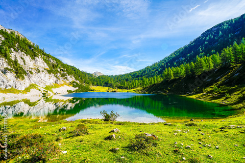 Schwarzensee on the high plateau of the Tauplitzalm. View of the lake at the Totes Gebirge in Styria. Idyllic landscape with mountains and a lake on the Tauplitz in Austria. 