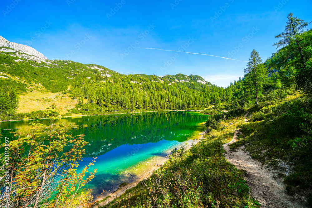 Steirersee on the high plateau of the Tauplitzalm. View of the lake at the Totes Gebirge in Styria. Idyllic landscape with mountains and a lake on the Tauplitz in Austria.