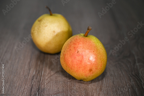 two juicy pears on a wooden table, studio shooting 1