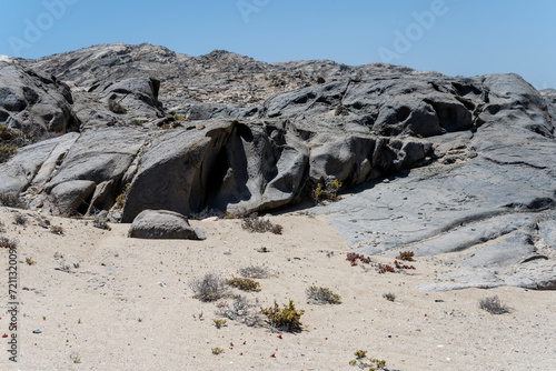worn basalt rocks on shore at Griffith bay, Namibia