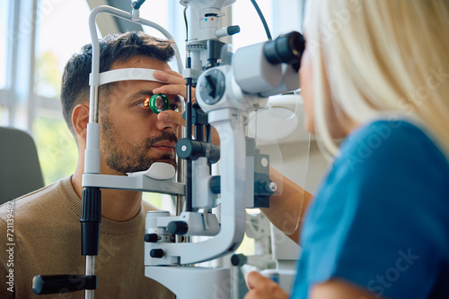 Young man having his eyesight tested at ophthalmologist's.