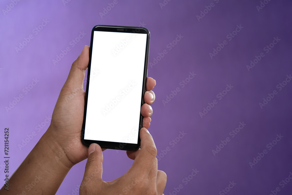 Female hand holding the black smartphone with blank screen and modern ...