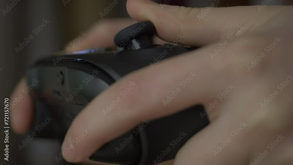 Close-up of Gamer Hands Playing Video Game on Console Using Joystick. Child Playing on Black Controller in Computer Video Game. Hands Person Playing Video Games on Console With Gamepad at Home. Close-up of Gamer Hands Playing Video Game on Console Using Joystick. Child Playing on Black Controller in Computer Video Game. Hands Person Playing Video Games on Console With Gamepad at Home.