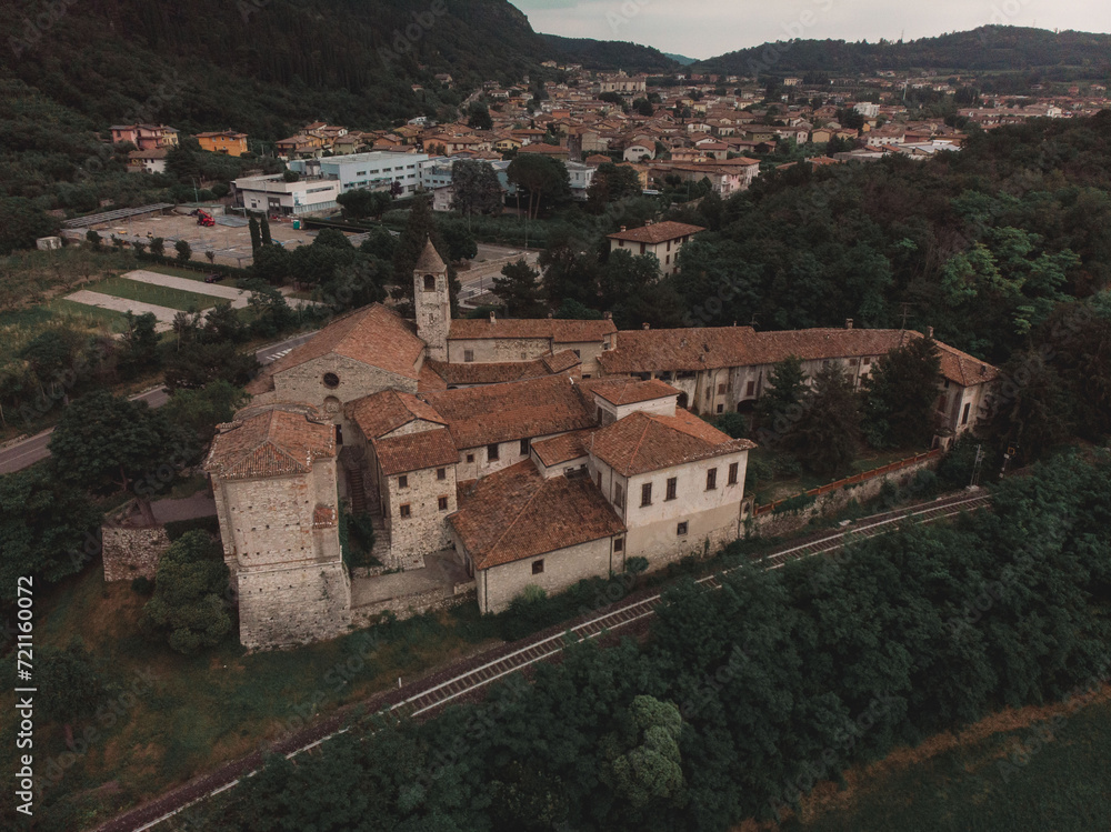 Panoramic view with drone on the roof of an ancient castle located on the top of a lagoon and in the background a town of an Italian town in Lombardy