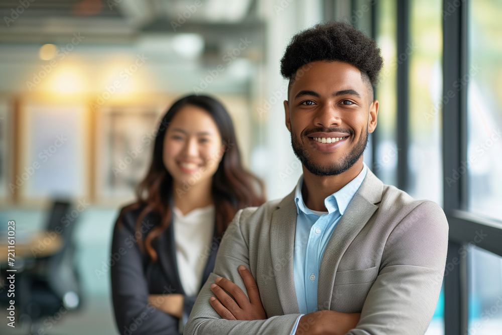 Smiling business man and woman of different races indoors Smiling business man and woman of different races indoors