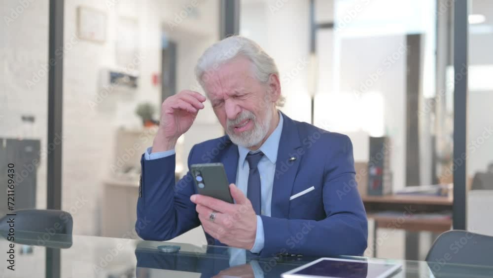 Old Businessman Shocked by Loss on Phone in Office Old Businessman Shocked by Loss on Phone in Office