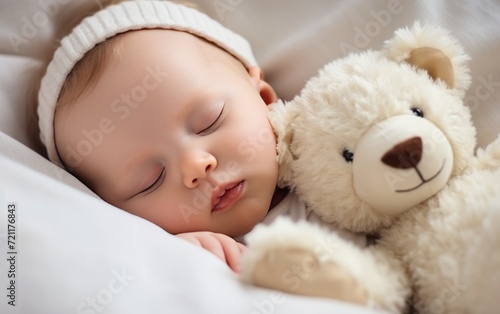 Carefree sleep little baby with a soft toy on the bed.