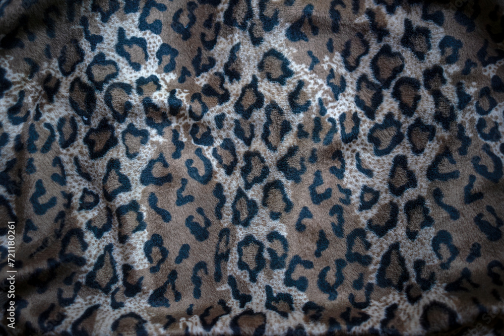 Photo of leopard cloth. The background of the leopard coloring texture.The clothes of the first people. Photo of leopard cloth. The background of the leopard coloring texture.The clothes of the first people.