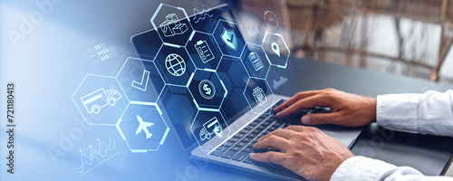 Businessman working with laptop, logistics icons on screen, technology concept