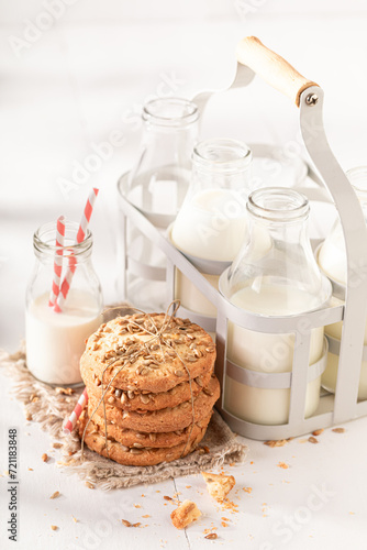 Tasty sunflower seed cookies served with milk in bottle.