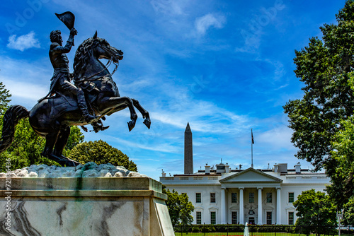 Statue of Andrew Jackson on horseback in Lafayette Square in front of the White House and the obelisk to the first president, in Washington DC, USA.