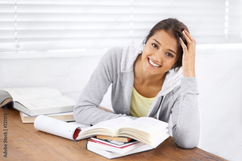 Portrait, learning and happy woman studying in university, reading and school project at desk. Face, books and smile of young student at table for education, knowledge and notes in college in Brazil Portrait, learning and happy woman studying in university, reading and school project at desk. Face, books and smile of young student at table for education, knowledge and notes in college in Brazil