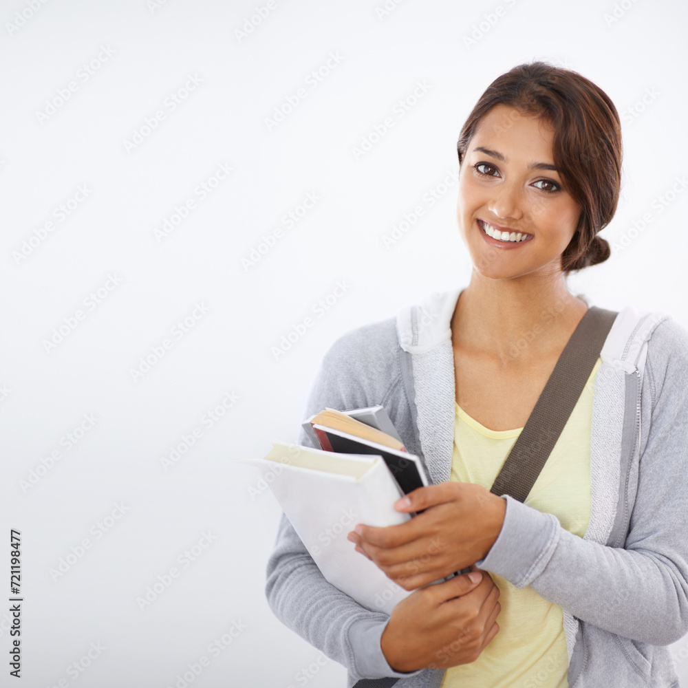 Portrait, student and happy woman with books in studio isolated on a white background mockup space. Face, textbook and person in university for education, knowledge or learning in college in Brazil Portrait, student and happy woman with books in studio isolated on a white background mockup space. Face, textbook and person in university for education, knowledge or learning in college in Brazil