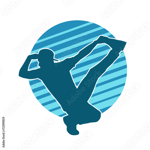 Silhouette of a slim man dancing pose. Silhouette of a male dancer in action pose.