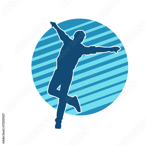 Silhouette of a slim man dancing pose. Silhouette of a male dancer in action pose.