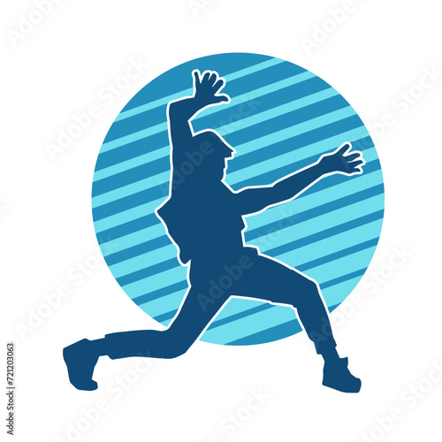 Silhouette of a slim man dancing pose. Silhouette of a male dancer in action pose.