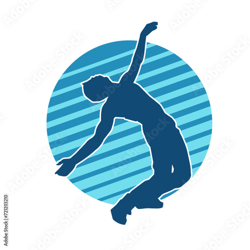 Silhouette of a slim man dancing pose. Silhouette of a male dancer in action pose.