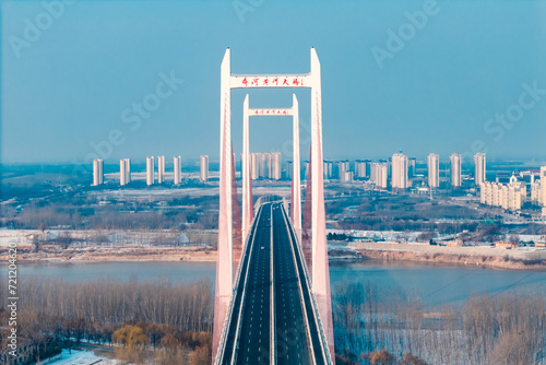 Qihe Yellow River Bridge in Dezhou, Shandong Province in winter photo