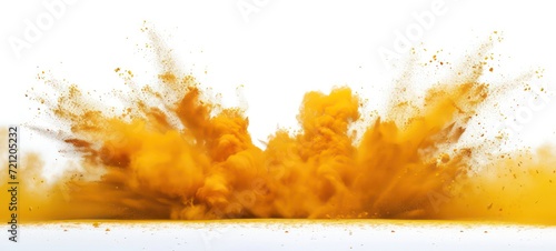 Yellow powder explosion on white background. Colored cloud. Colorful dust explode. Paint Holi. photo