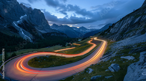 Car light trails stretching along winding road