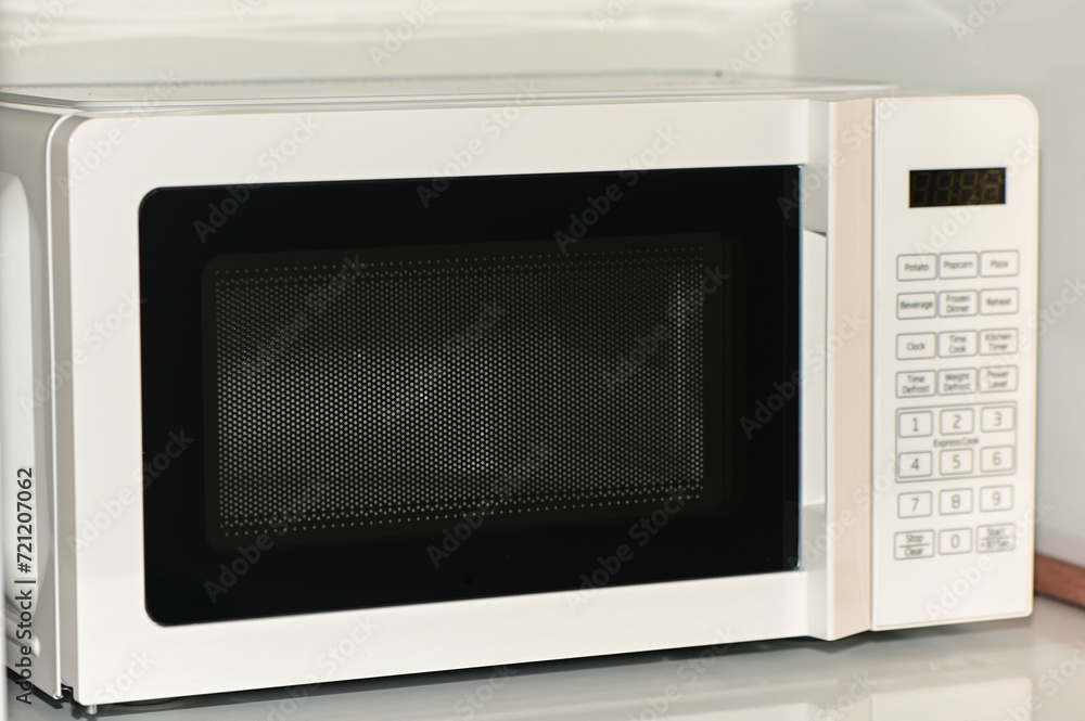 Fototapeta premium white microwave in the kitchen 1