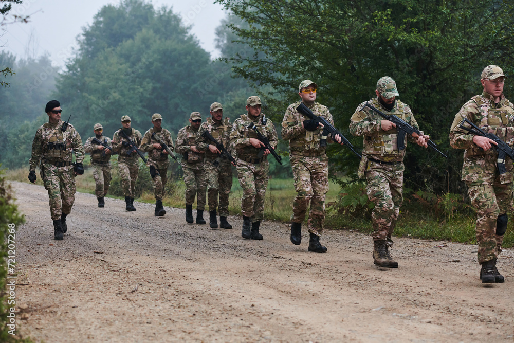 An elite military unit, led by a major, confidently parades through dense forest, showcasing precision, discipline, and readiness for high-risk operations An elite military unit, led by a major, confidently parades through dense forest, showcasing precision, discipline, and readiness for high-risk operations