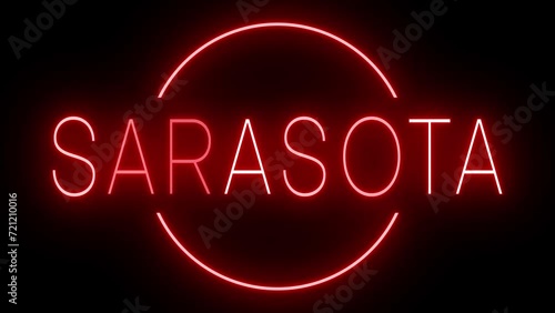 Flickering red retro style neon sign glowing against a black background for SARASOTA photo