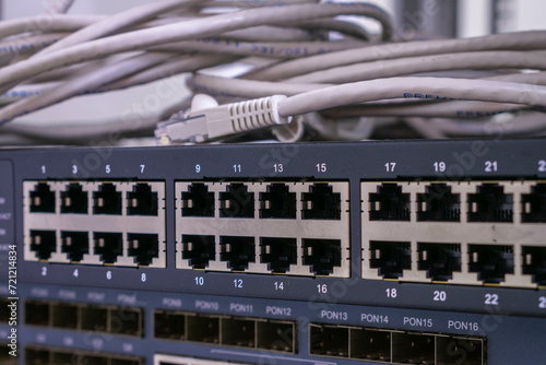 Εκτύπωση καμβά There is a close-up of an Internet communication switch with many empty ports