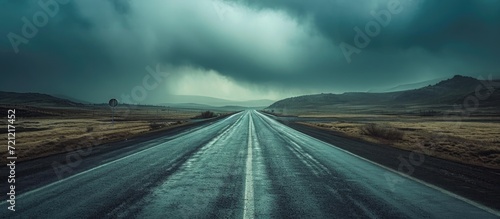 Driving on a desolate road during a storm.
