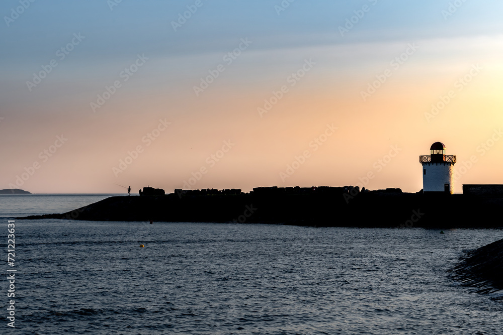 Burry Port Lighthouse And Atlantic Coast During Sunset In Carmarthenshire, Wales, United Kingdom