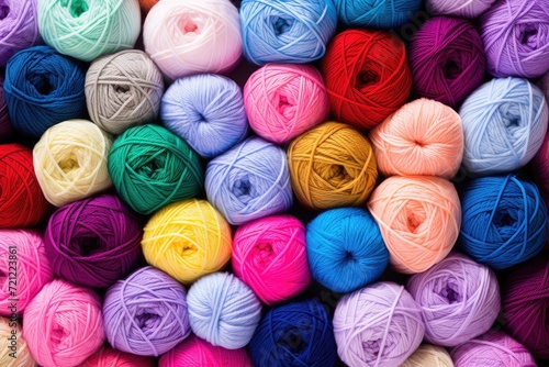 many colorful yarn balls are sitting in a pile topview flatlay