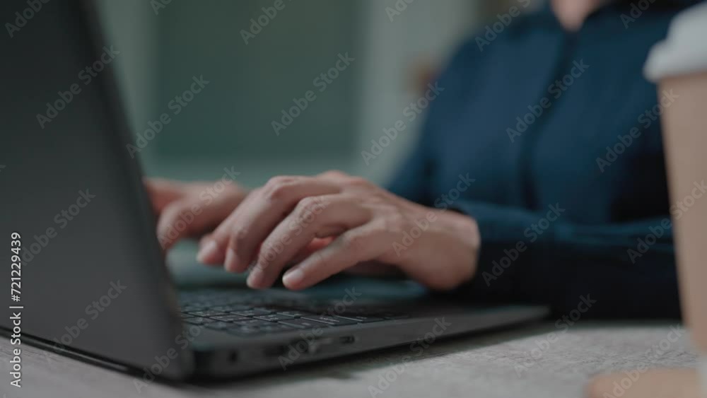 Close-up woman working on computer using touchpad typing company messages communicating with customers Close-up woman working on computer using touchpad typing company messages communicating with customers