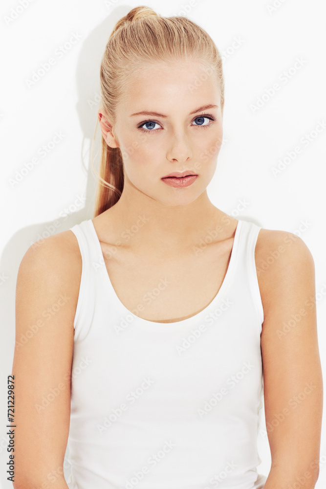 Portrait, workout and serious young woman in studio isolated on a white background. Face, healthy body and person exercise, blonde athlete training and sportswear for physical fitness in Switzerland Portrait, workout and serious young woman in studio isolated on a white background. Face, healthy body and person exercise, blonde athlete training and sportswear for physical fitness in Switzerland