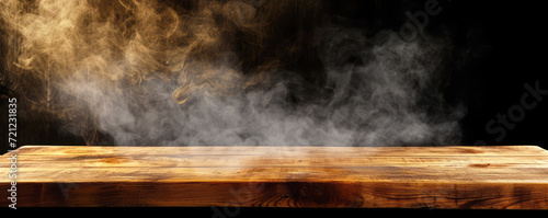 Empty wooden table with smoke on dark background. Empty space for product display.