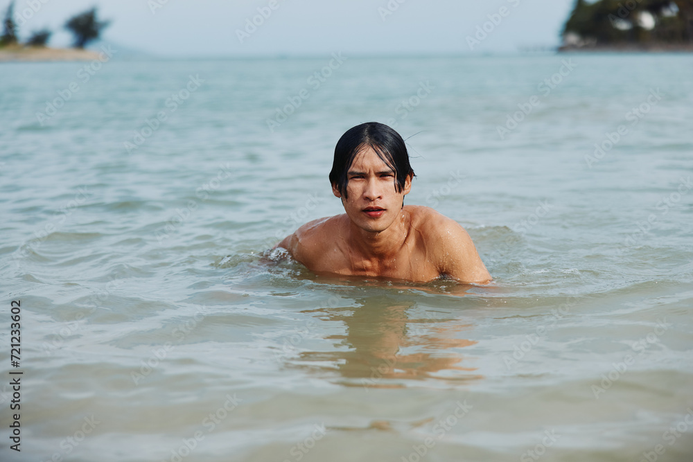 Smiling Asian Man Enjoying Active Water Sport in Tropical Paradise
