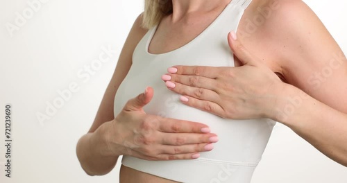 Wallpaper Mural Breast cancer self-examination woman touches breast. Prevent disease and breast cancer Torontodigital.ca