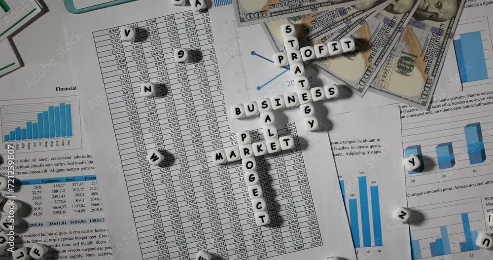 Top view of business strategy, profit and market sales crosswords. Puzzle assembled from cubes on statistical documents Top view of business strategy, profit and market sales crosswords. Puzzle assembled from cubes on statistical documents